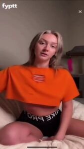 Twenty Year Old Thot Keep Showing Pierced Nips Slips Under Her Orange Croptop on Live TikTok