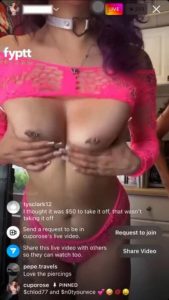 Tattooed girl trying her new pink lingerie on Live and showing her tits with a friend