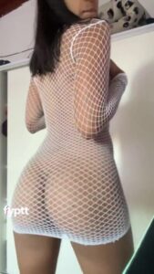 Hot slender tanned thot shaking her small round ass in fish net white night dress