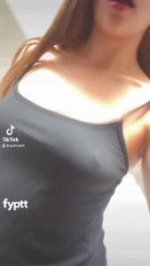 Young brunette in provocative lingerie showing her firm round butt on TikTok